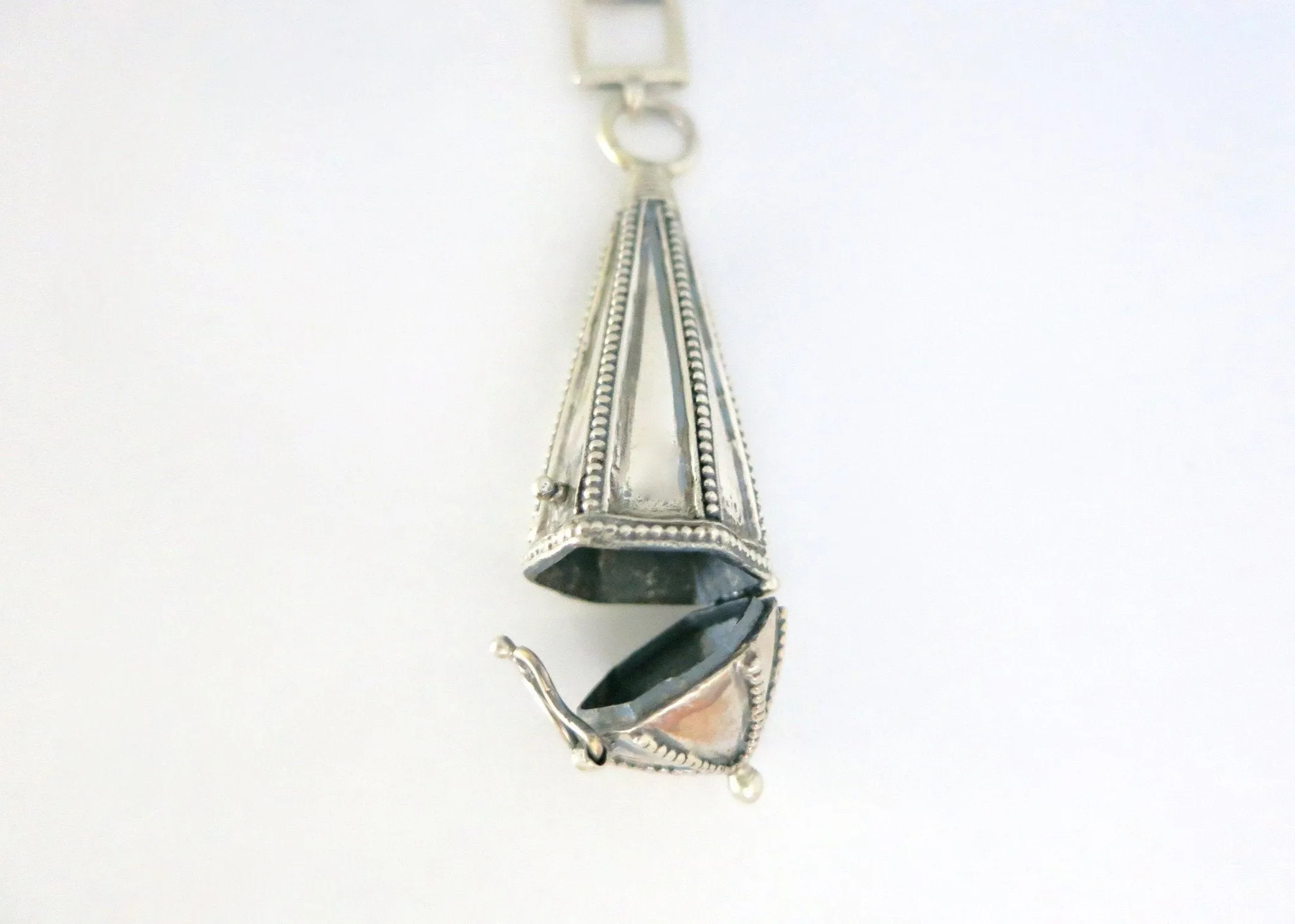 Vintage-chic, long amuletic pendant in sterling silver with fine granulation work